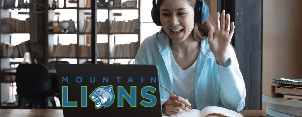 female student wearing headphones attending online class at Virtual Prep of West Virginia. academics